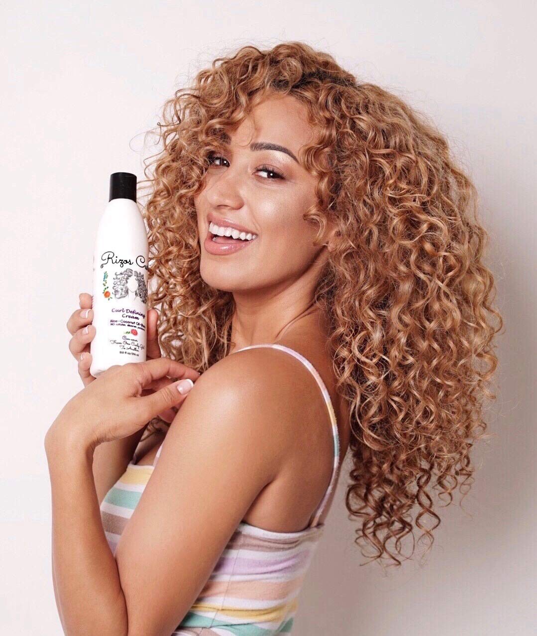 Rizos Curls Hydrating Shampoo label view emphasizes hydrating care for curls.