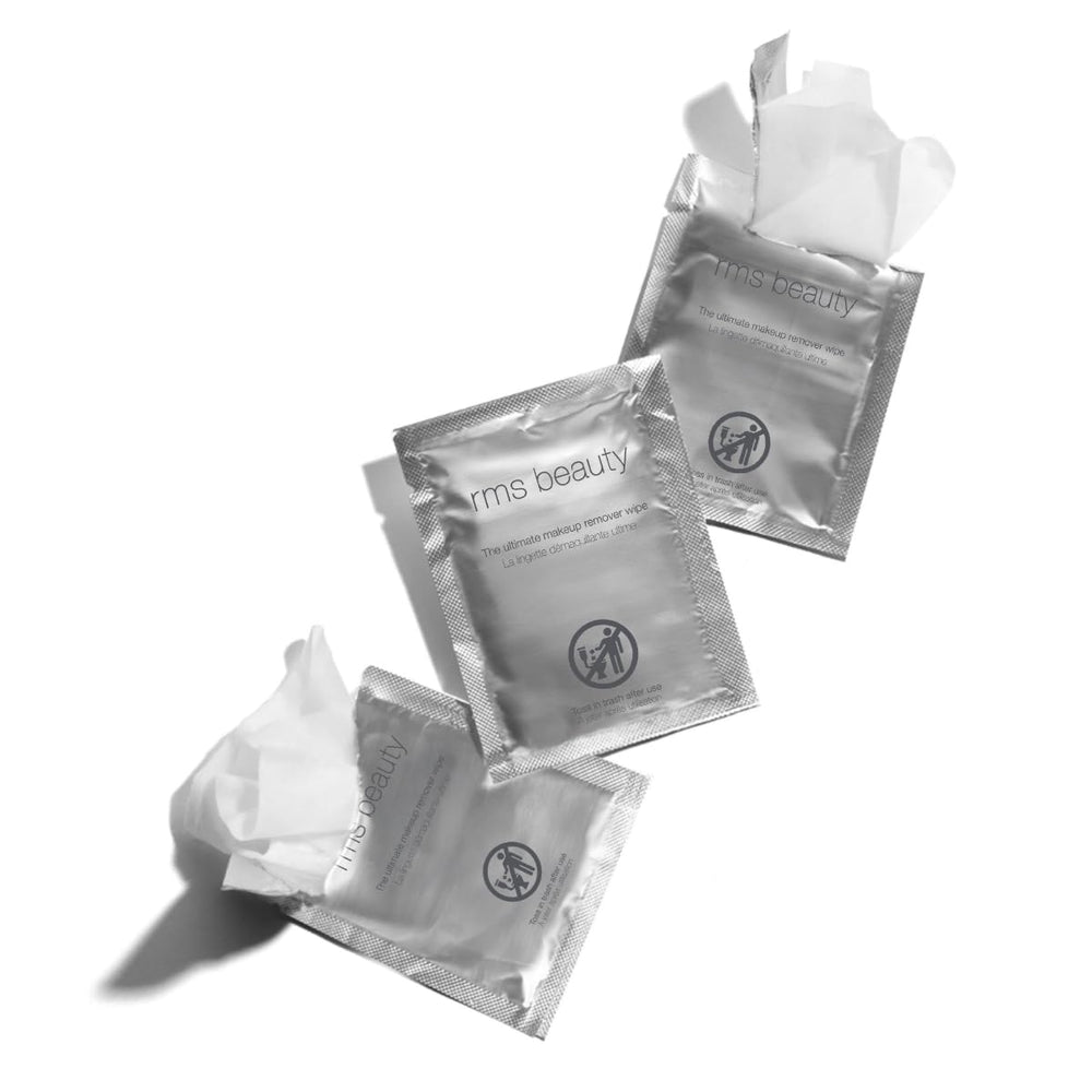 RMS Beauty Makeup Remover Wipes travel pack in bag for on-the-go cleansing.