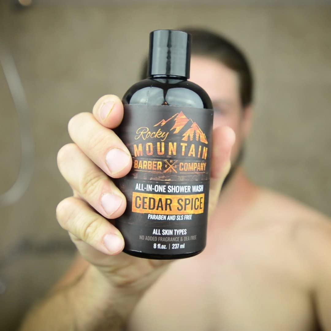 Rocky Mountain Barber Cedar Spice body wash being applied in shower.