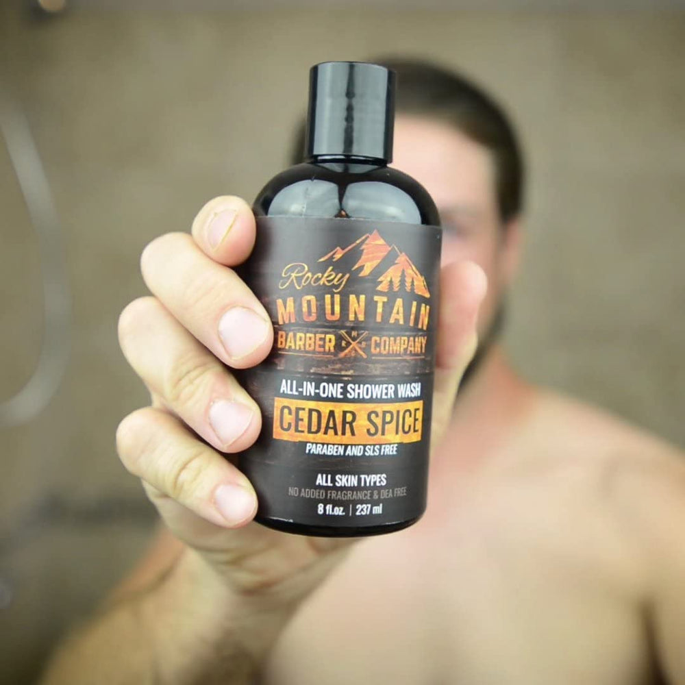 Rocky Mountain Barber Cedar Spice body wash being applied in shower.