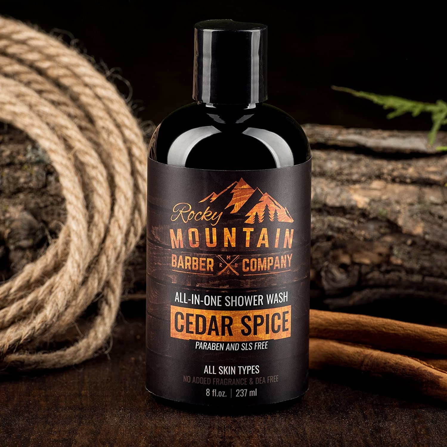 Rocky Mountain Barber Cedar Spice shampoo-wash flowing through wet hair.