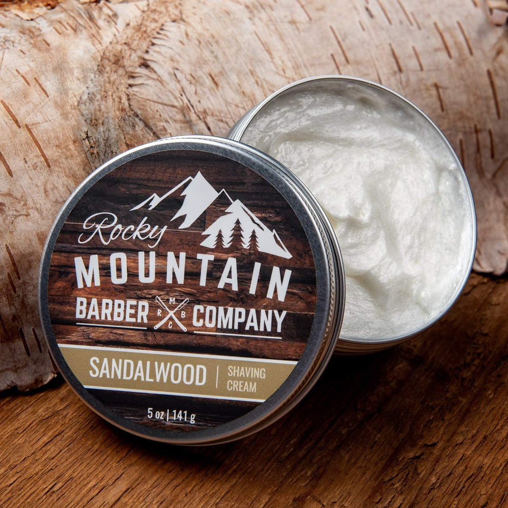 Rocky Mountain Barber Co thick-lather shaving cream being applied by hand.