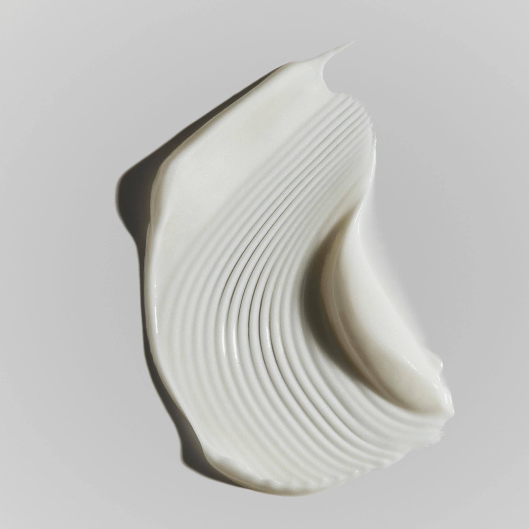 RODAN + FIELDS Active Hydration Body Replenish applied to arm after shower for dry-skin relief.