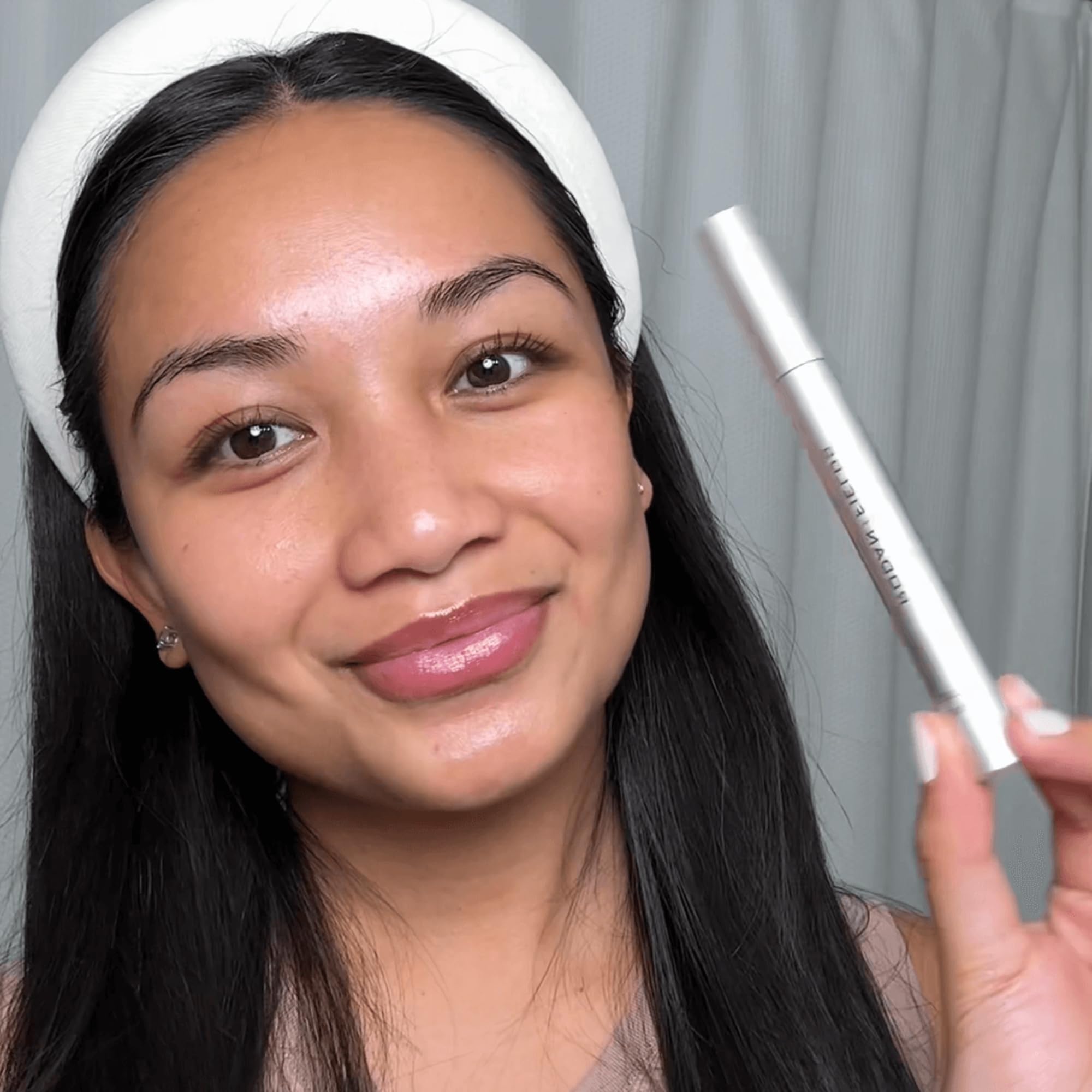 Rodan + Fields Lash Boost Serum on lashes shows conditioning for longevity