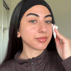 Rodan + Fields redefine pore toner on cotton pad for refreshing cleanse.
