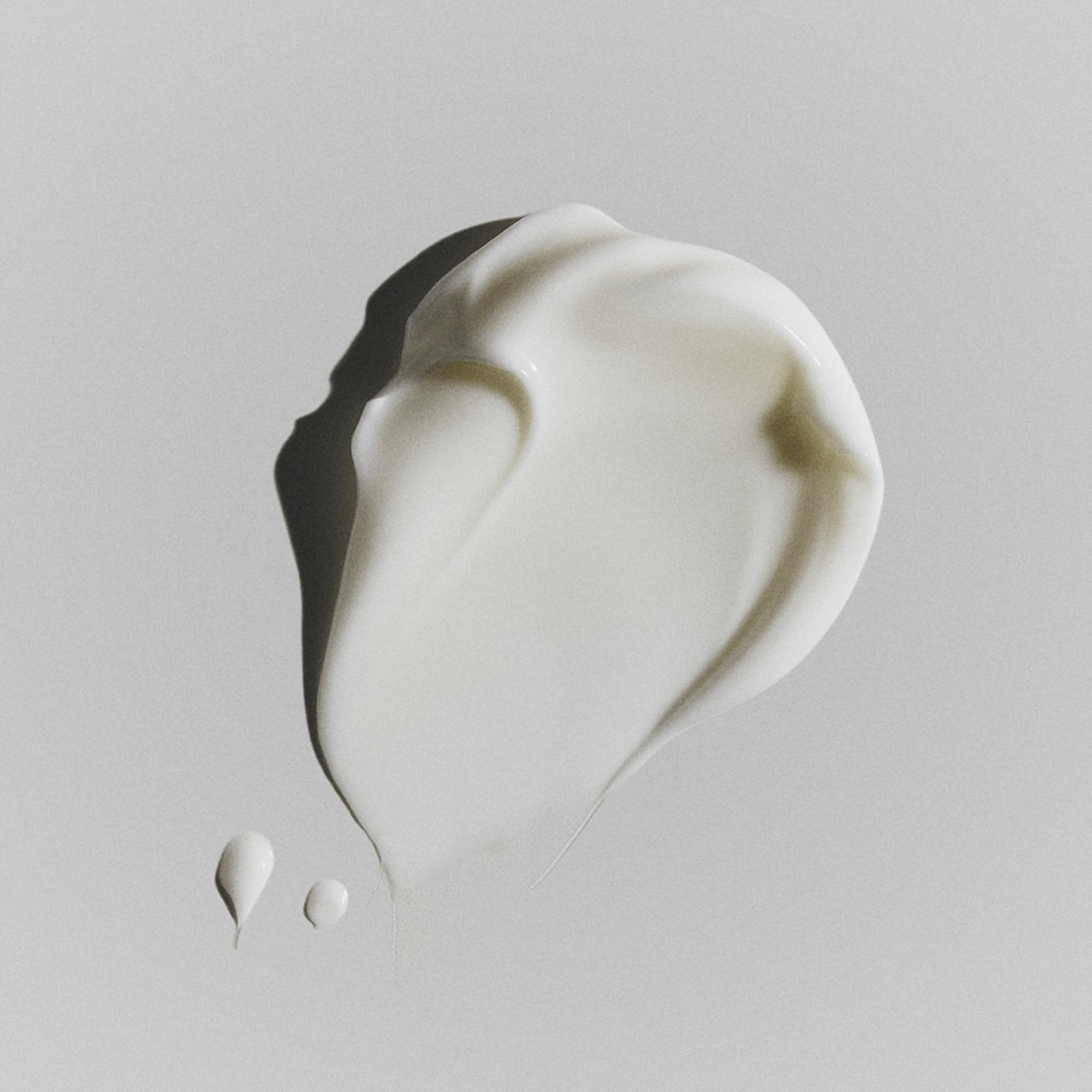 RODAN + FIELDS Redefine shea butter-rich formula shown on smooth skin surface.