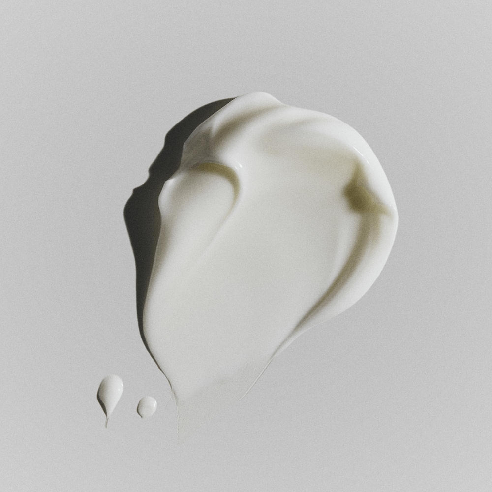 RODAN + FIELDS Redefine shea butter-rich formula shown on smooth skin surface.