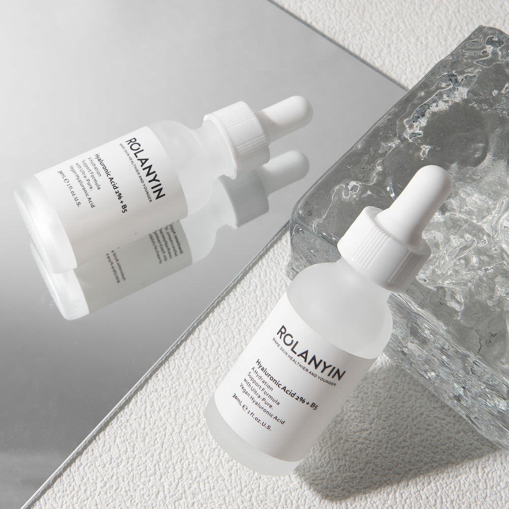ROLANYIN Hyaluronic Acid 2% + B5 Serum swirl on skin emphasizes smooth, hydrated texture.