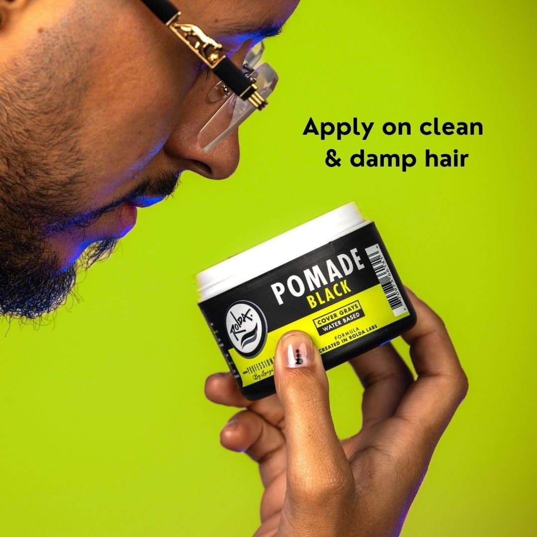 Rolda Black Pomade jar open revealing creamy formula for easy application.