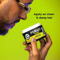 Rolda Black Pomade jar open revealing creamy formula for easy application.