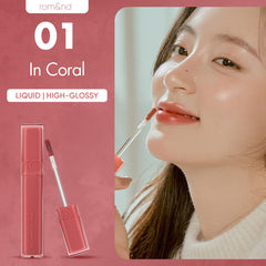 rom&nd DEWYFUL Water Tint coral creates a wet-gloss look on lips
