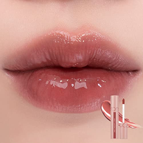 rom&nd JUICY LASTING TINT #23 NUCADAMIA application shot showing smooth glide