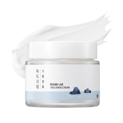 ROUND LAB 1025 Dokdo Cream jar closeup showing dense texture for lasting hydration.