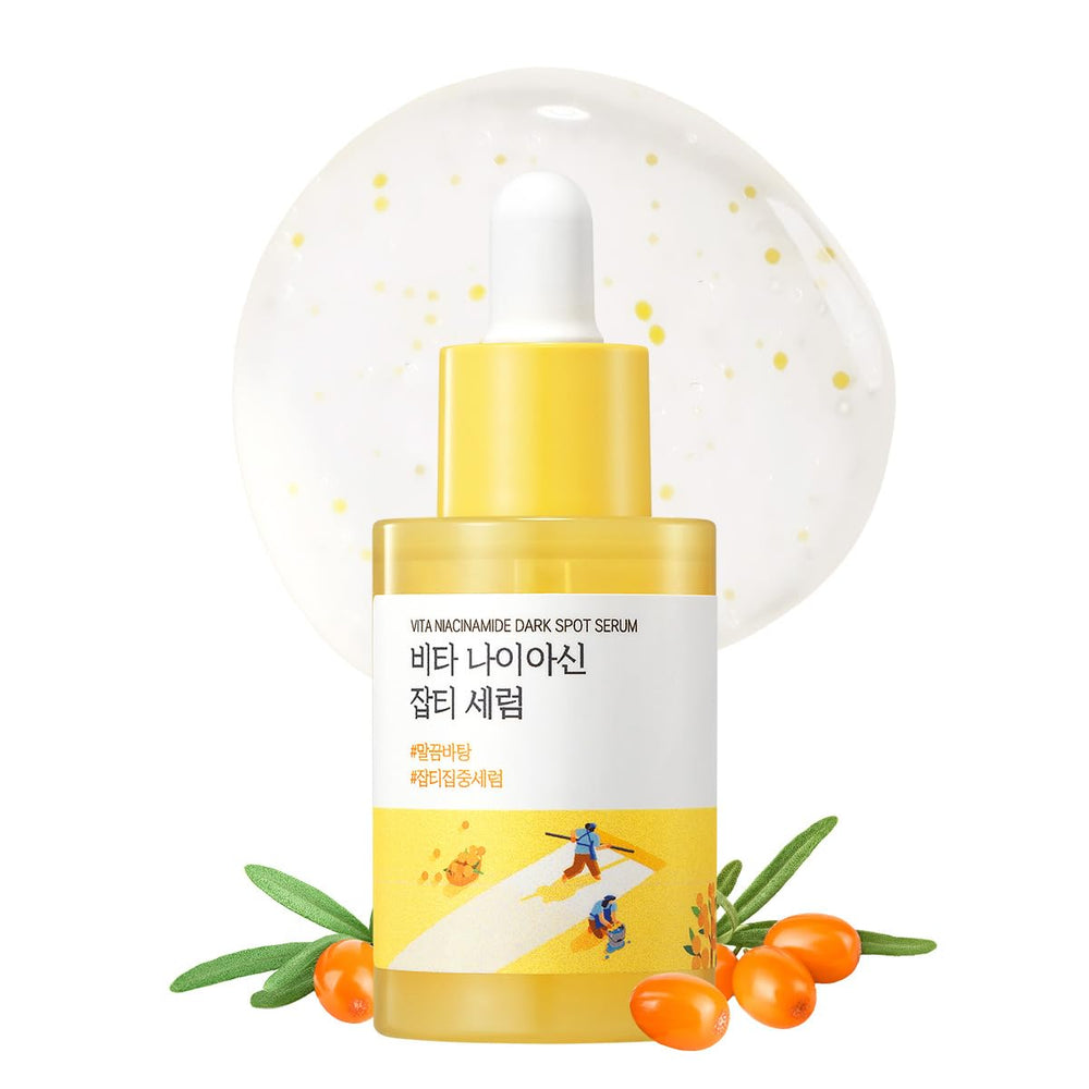 ROUND LAB Vita Niacinamide Dark Spot Serum bottle closeup highlights radiance-boosting formula for even skin tone.