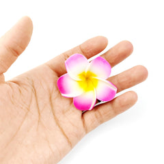 ROYHOO Hawaiian flower hair clip on a model at a seaside wedding for beach-ready style.