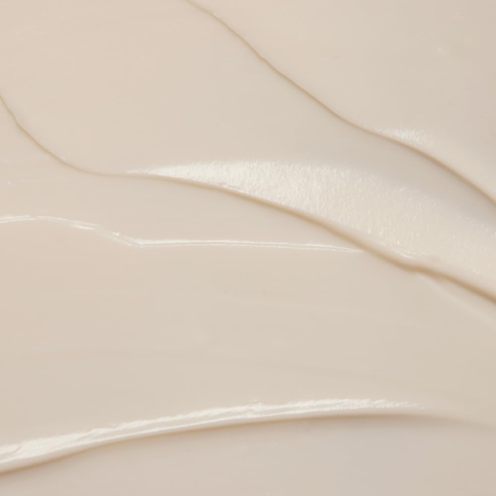 RŌZ Evergreen styling cream shown in a compact 2 oz bottle.