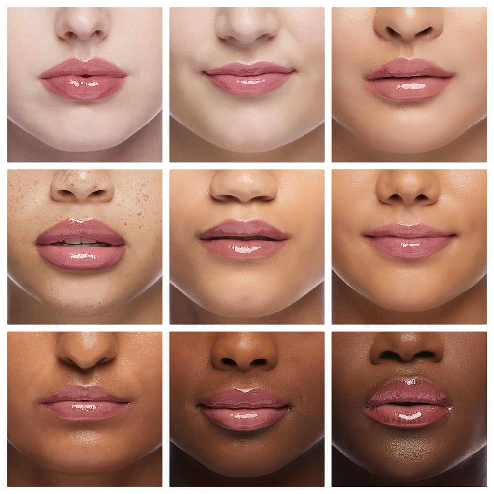 Ruby Kisses Broadway Vita-Lip Gloss wand applying for smooth hydration.