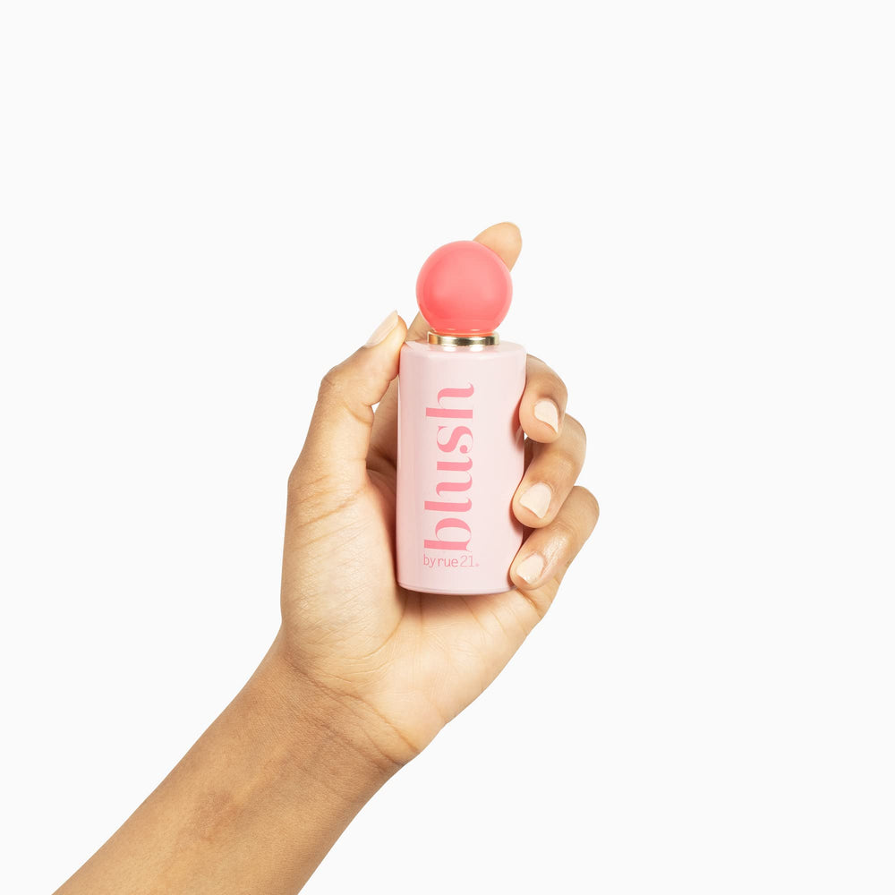 Rue 21 Blush glossy label enhancing the luxe fragrance experience.