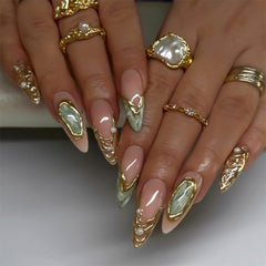 RUOKEXIN almond nails with gold glitter designs for a glam party look.
