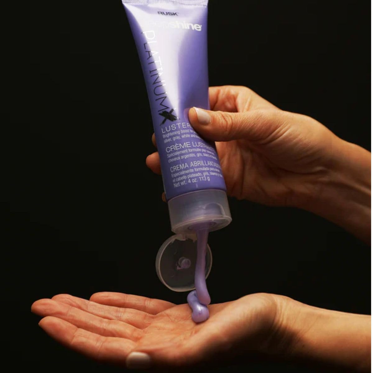 RUSK PlatinumX Lusterizer applied to hands for easy distribution.