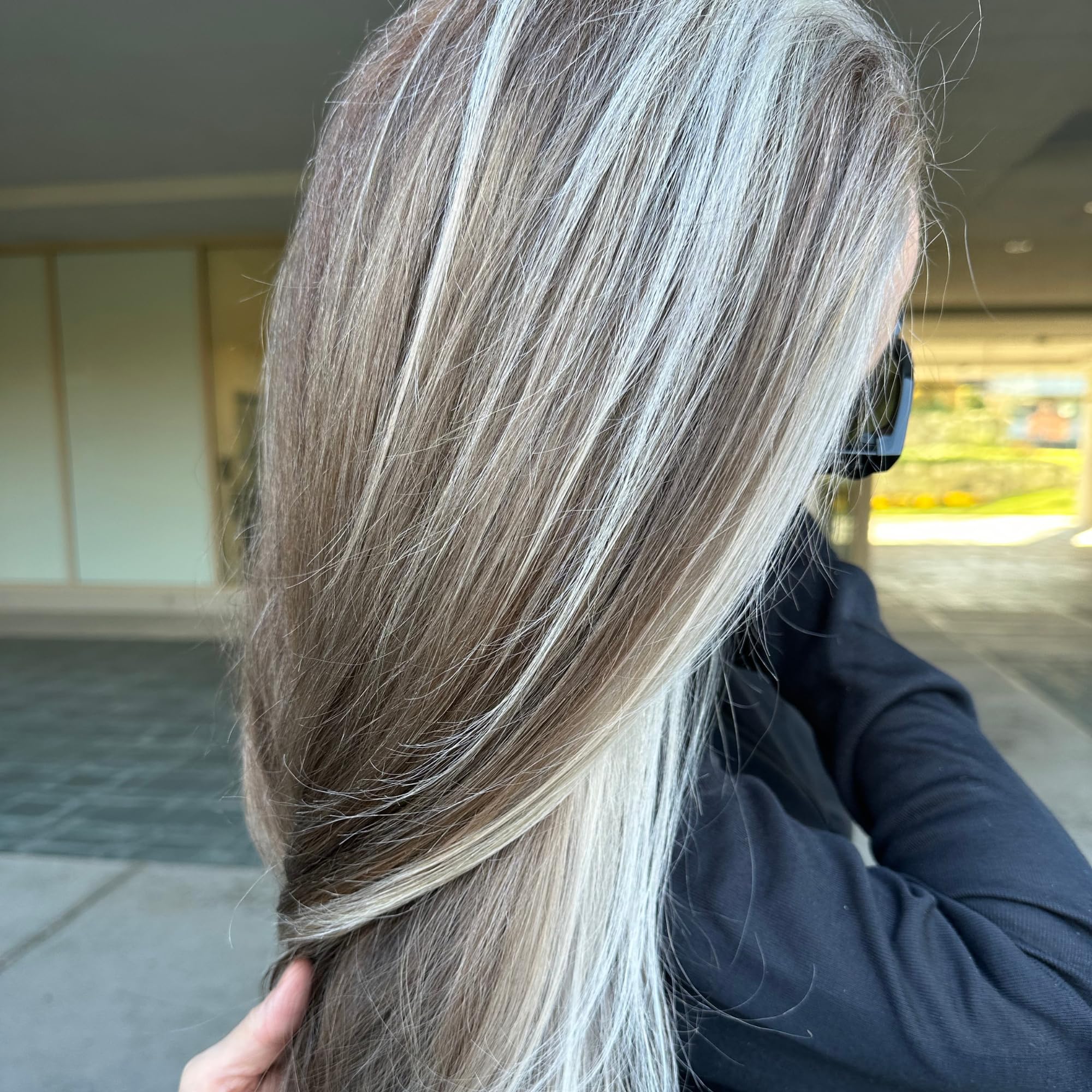 Hair after using RUSK PlatinumX Repair Treatment showing healthy glow on platinum hair.