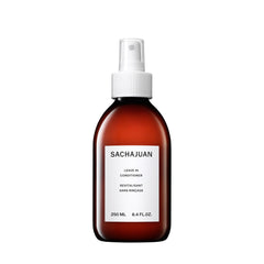 SACHAJUAN Leave-In Conditioner bottle close-up; lightweight, oil-free formula for shine.