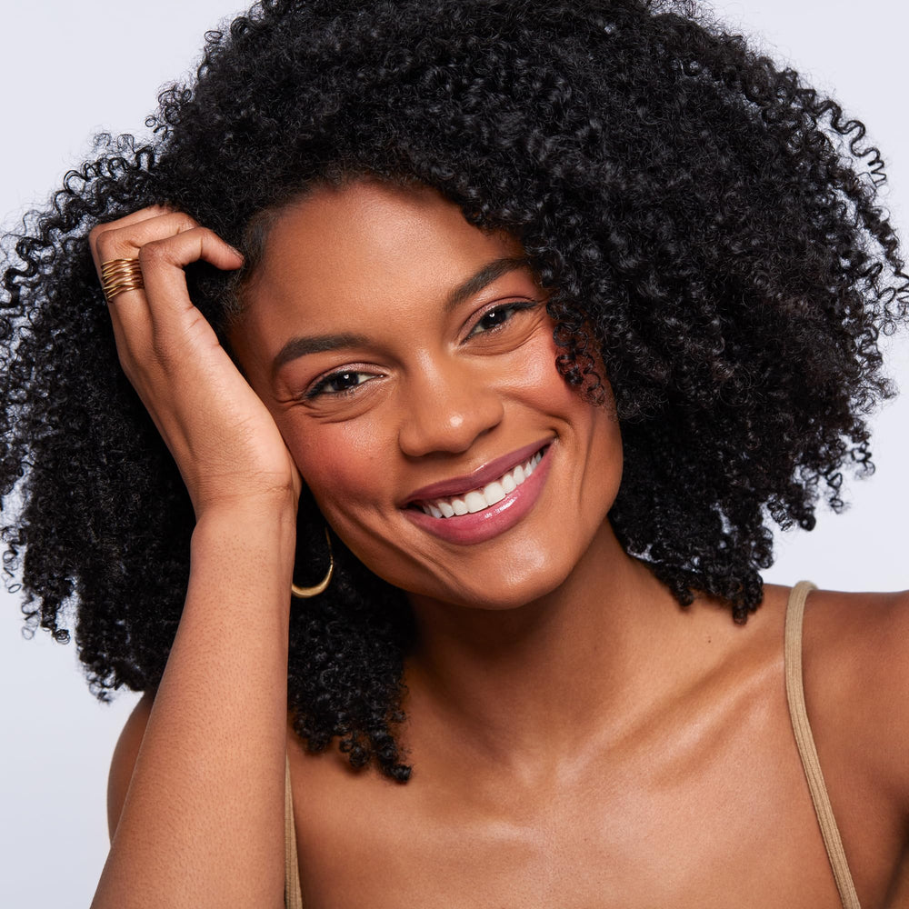 Saie Dew Liquid Blush on skin creates lit-from-within glow.