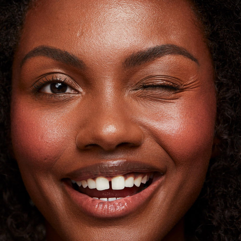 Saie Dew Liquid Blush on cheek delivers hydrated, radiant flush.