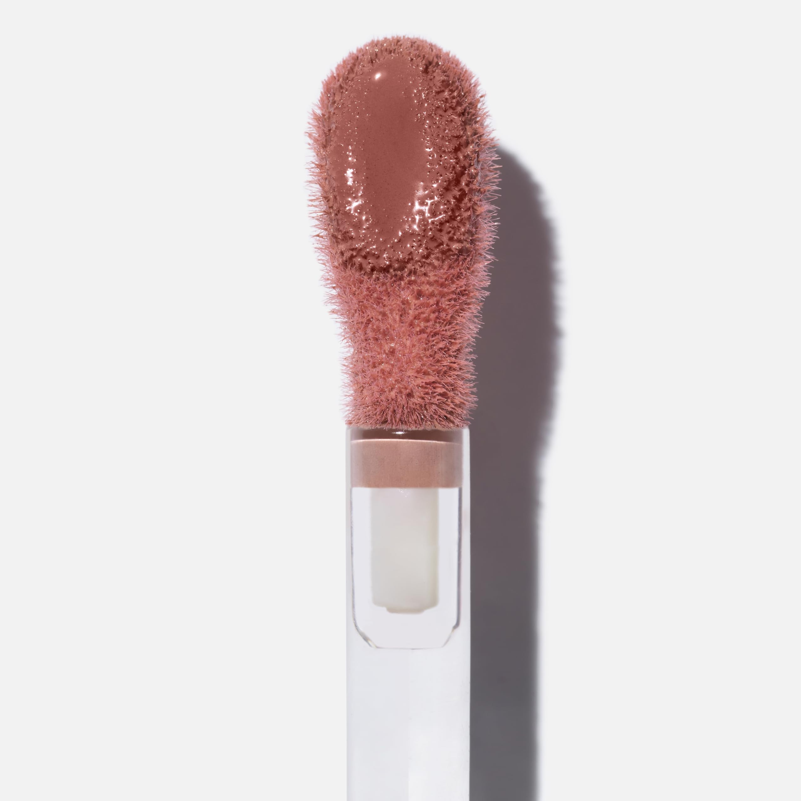 Saie Dew Liquid Blush swatch reveals creamy texture and natural tint.
