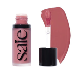 Saie Dew Liquid Blush wand-application shows buildable color for a natural flush.