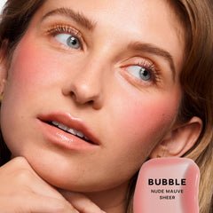 Close-up of the doe-foot applicator applying GlossyBounce for hydrating gloss.