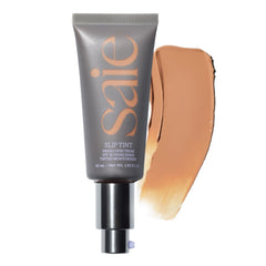 Saie Slip Tint bottle close-up showing dewy glow and SPF 35 protection