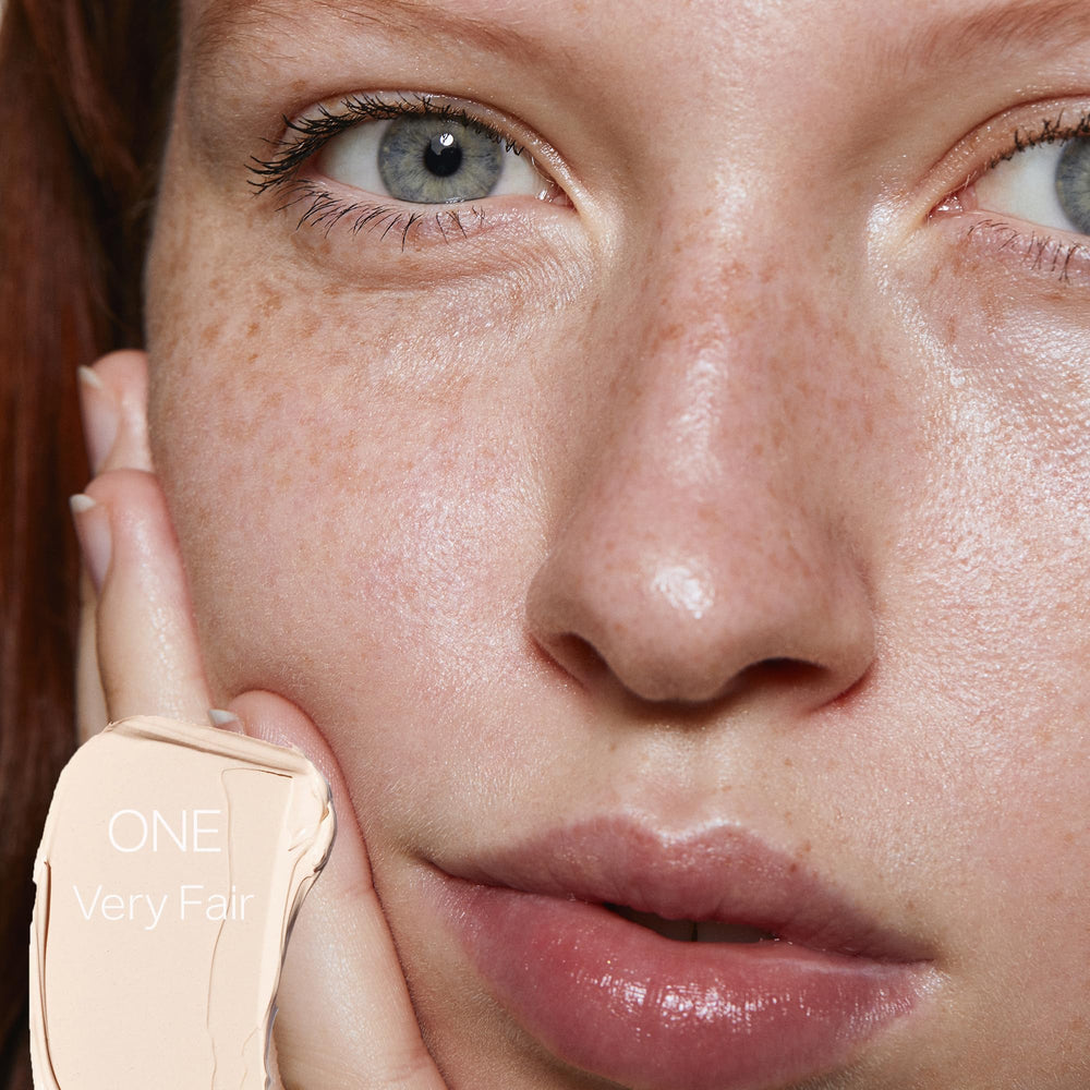 Saie Slip Tint fingertips application demonstrates quick, even coverage for a natural glow.