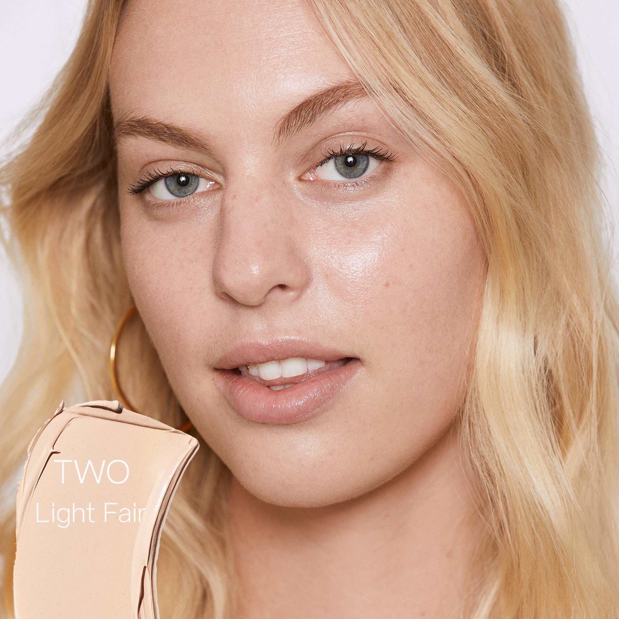 Saie Slip Tint close-up on cheek highlighting glow and hydration