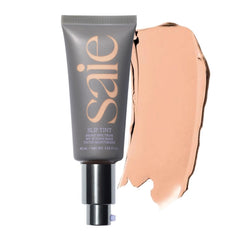 Saie Slip Tint SPF 35 application close-up showing lightweight glow and hydration