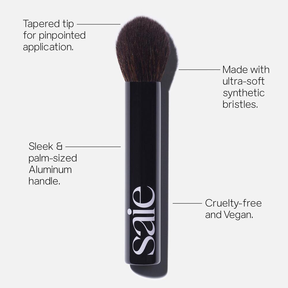 Saie The Fluffy Brush palm-size handle supports travel-ready makeup routines.