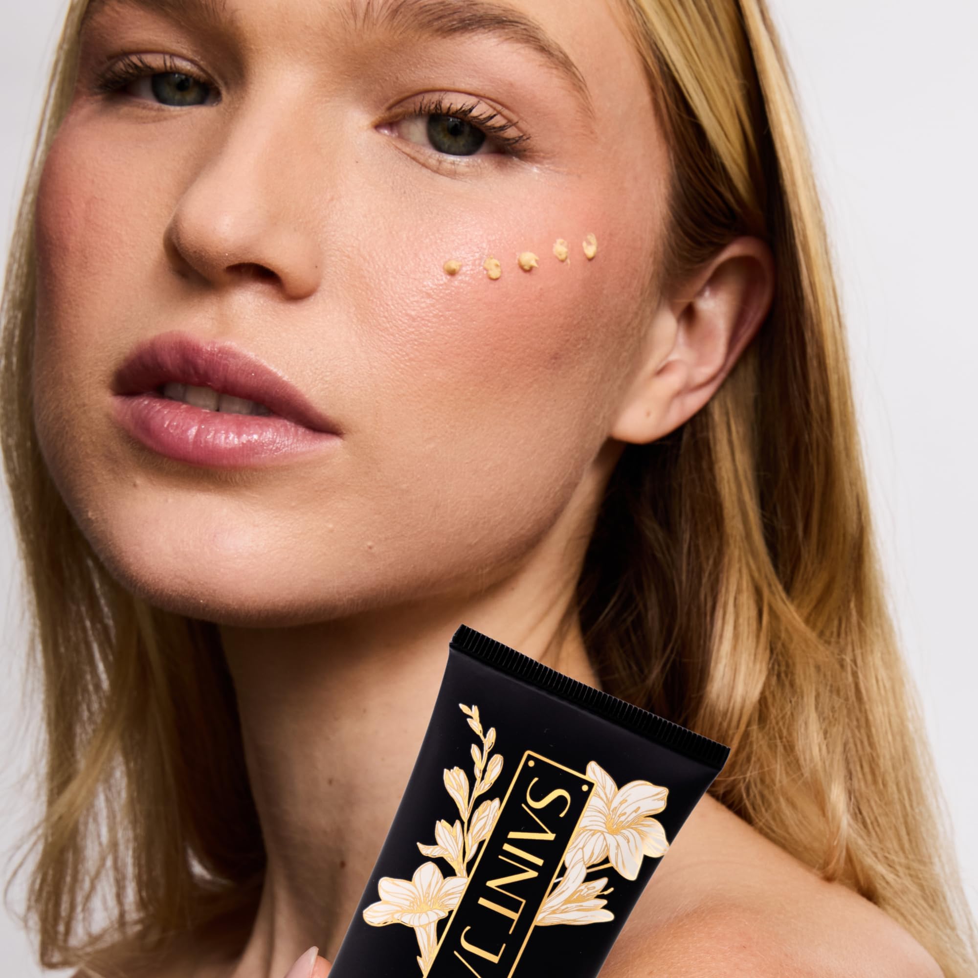 All skin types-friendly SAINT JANE sunscreen image suggests gentle mineral protection.