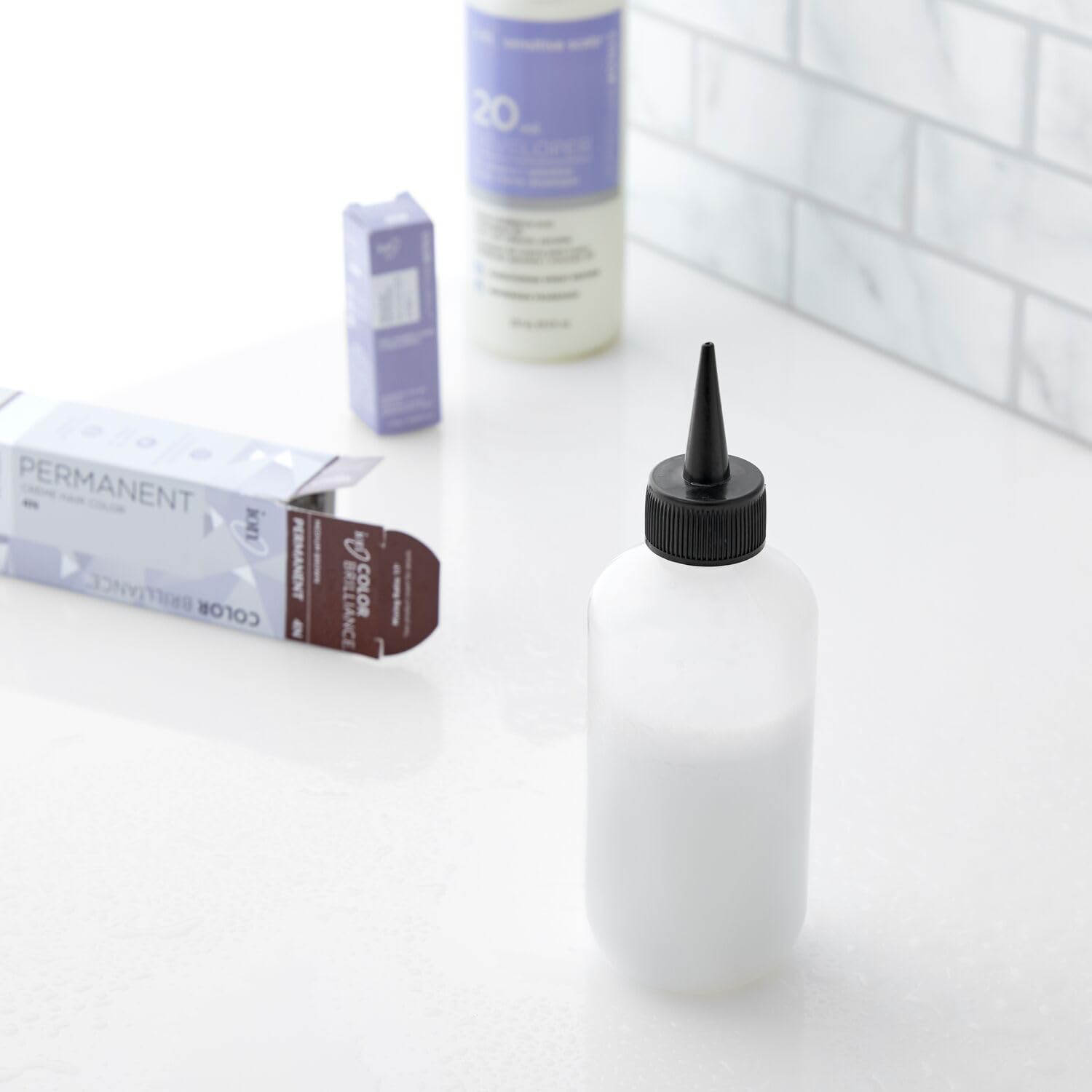 Salon Care Narrow Tip Applicator Bottle highlights easy squeeze grip for comfort