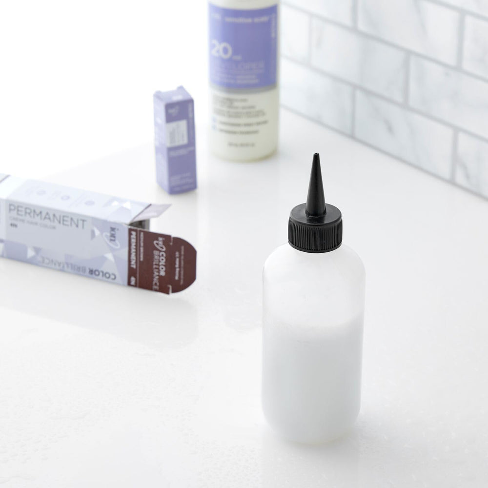 Salon Care Narrow Tip Applicator Bottle highlights easy squeeze grip for comfort