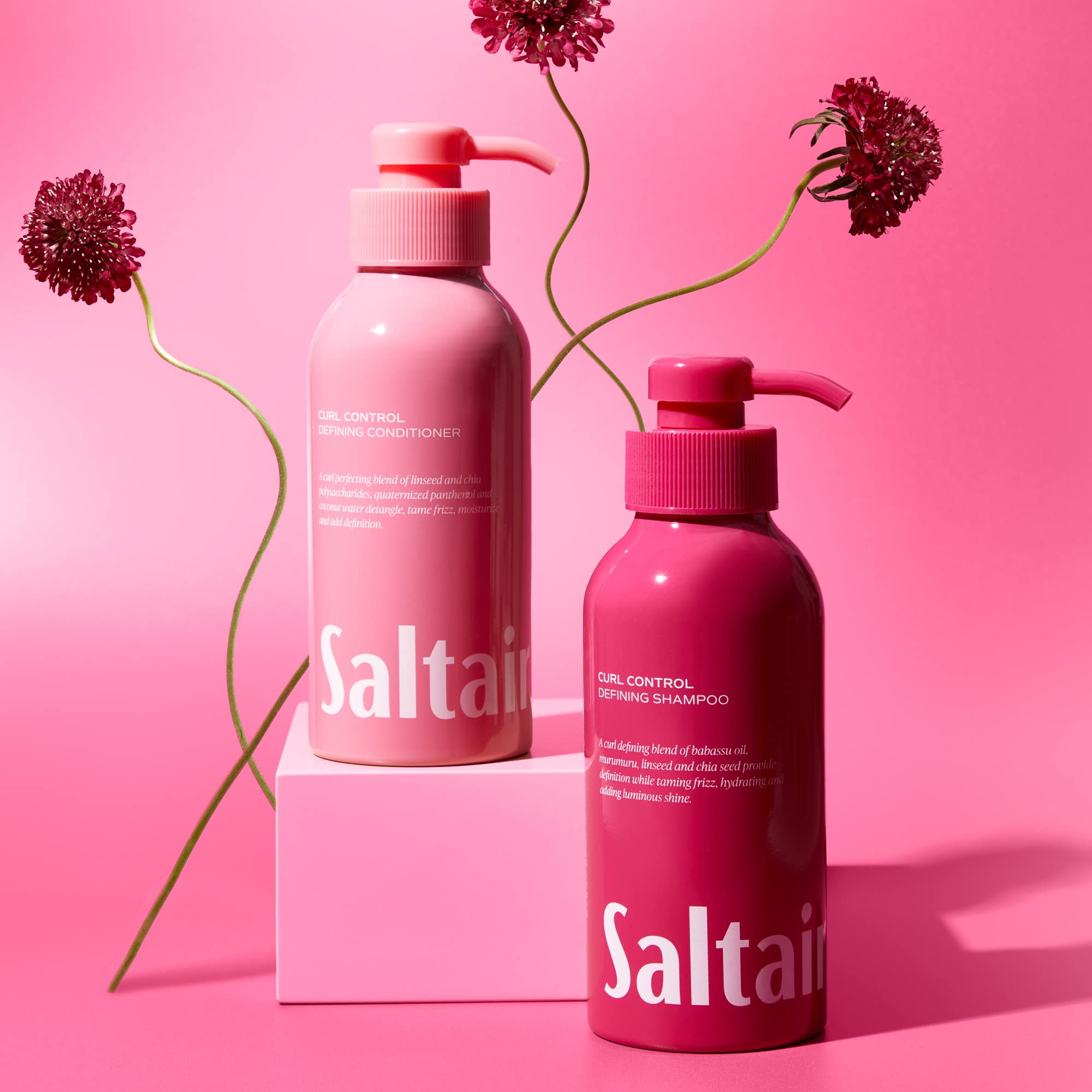 Saltair Almond scent conditioner bottle closeup invites detangling and smoother curls.