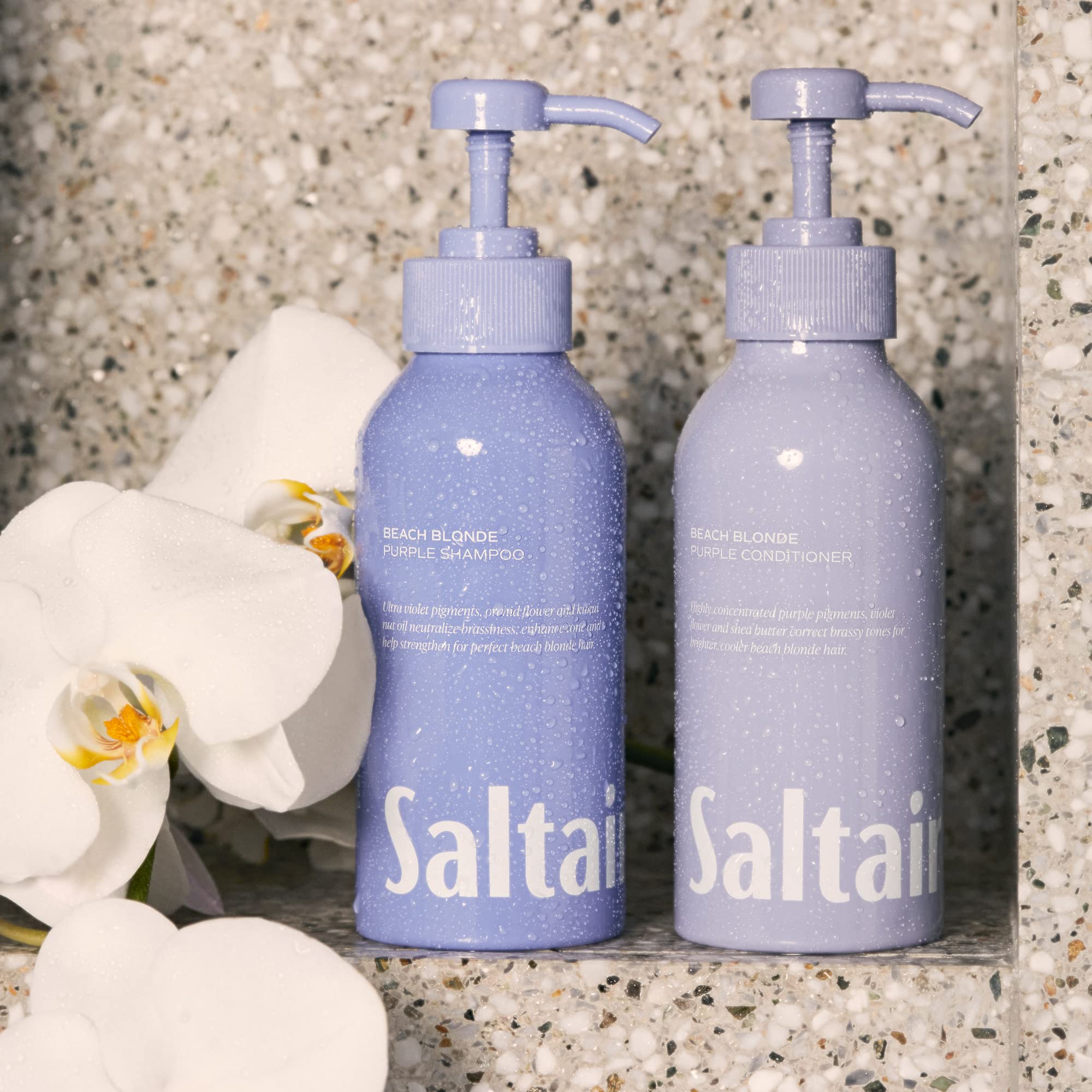 Saltair Beach Blonde Conditioner on hair model for smoother, shinier results.