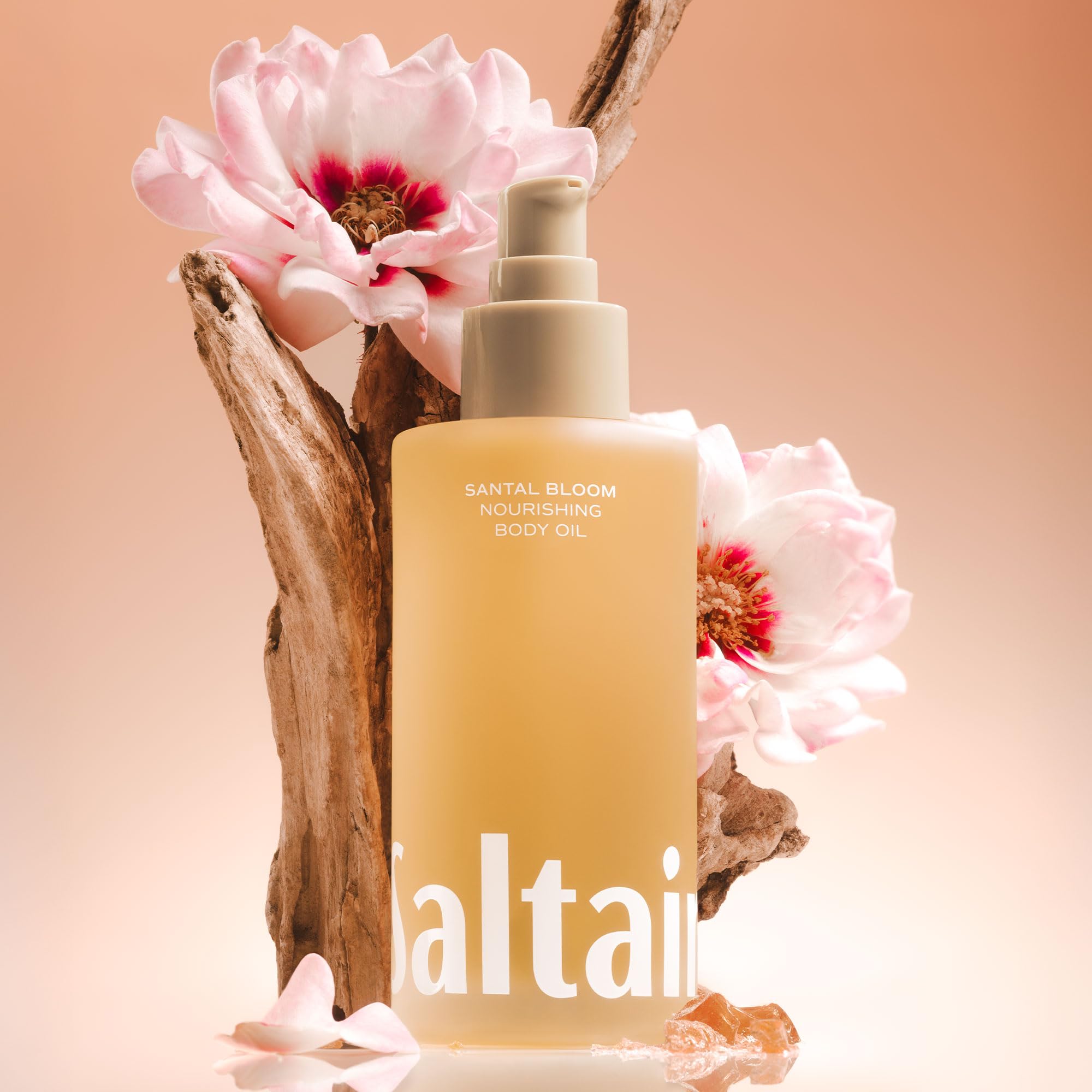 Saltair Body Oil being dispensed into palms demonstrates fast-absorbing lightweight hydration.