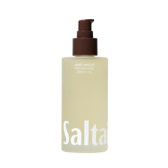 Saltair Driftwood Body Oil bottle on a bathroom shelf showing quick hydration