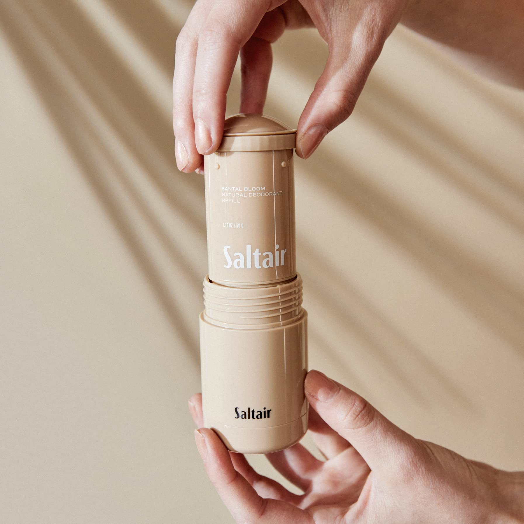 Minimalist bathroom counter featuring Saltair Santal Bloom among skincare products.