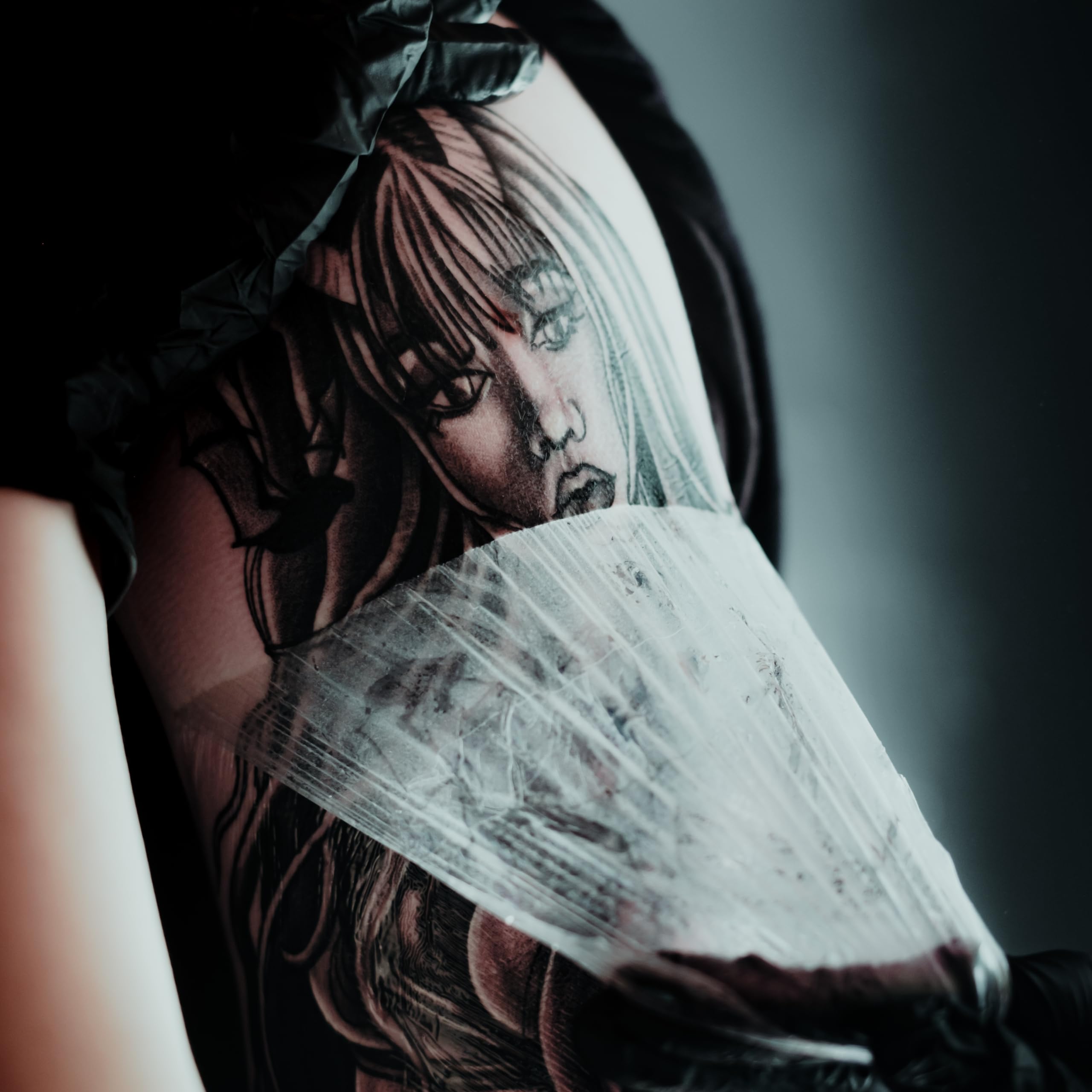 Tattoo aftercare setup demonstrating protective, waterproof coverage during everyday activities.