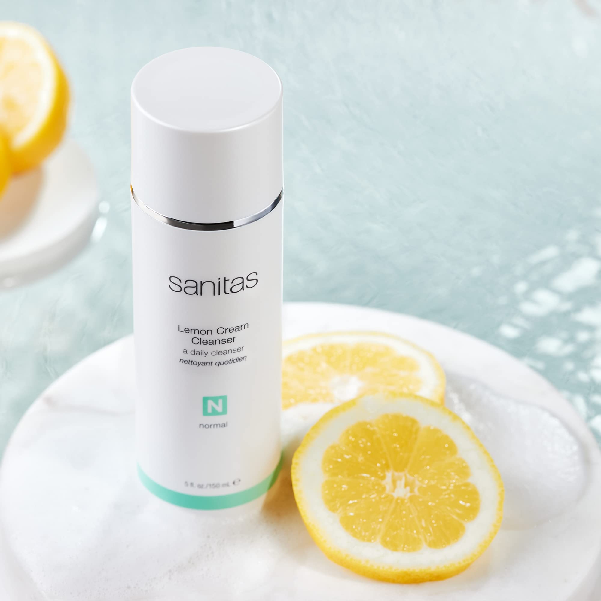 Sanitas Lemon Cream Cleanser pour shows even distribution for gentle daily cleansing.