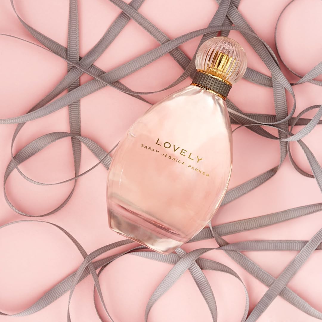 Sarah Jessica Parker Lovely bottle closeup on glass surface for premium presence.
