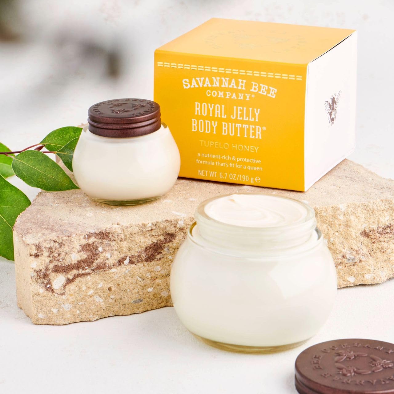 Sample spoon of Savannah Bee body butter on wood surface