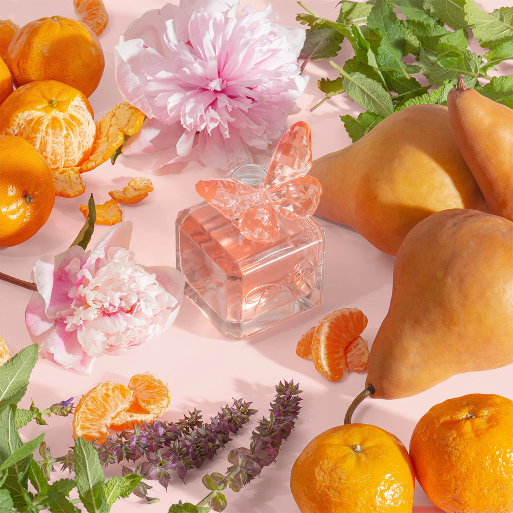 Scent Beauty Dolly Parton Scent from Above pink butterfly bottle highlights portable elegance for travel.