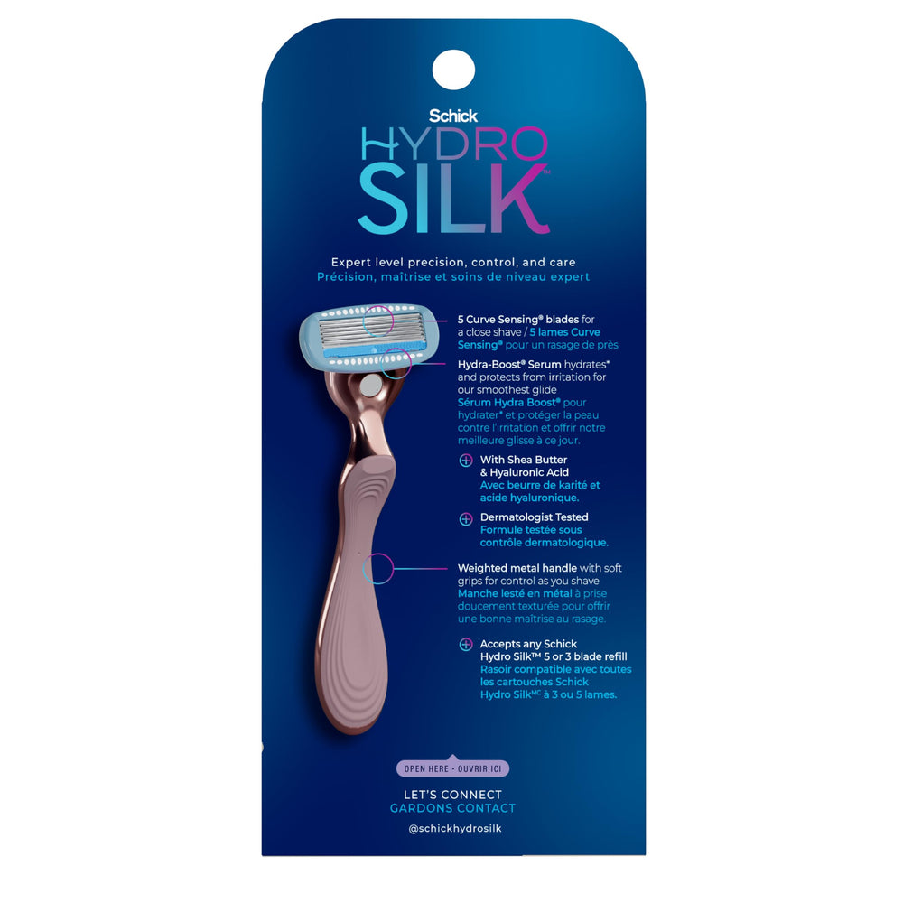 Schick Hydro Silk rose-gold razor in use on leg with smooth glide.